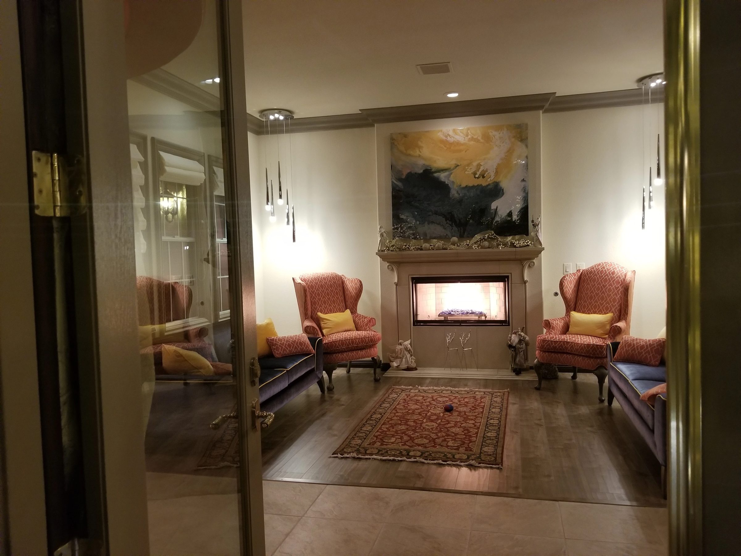 Kuda Huraa by Joline Renn — Above the fireplace in the collector's home