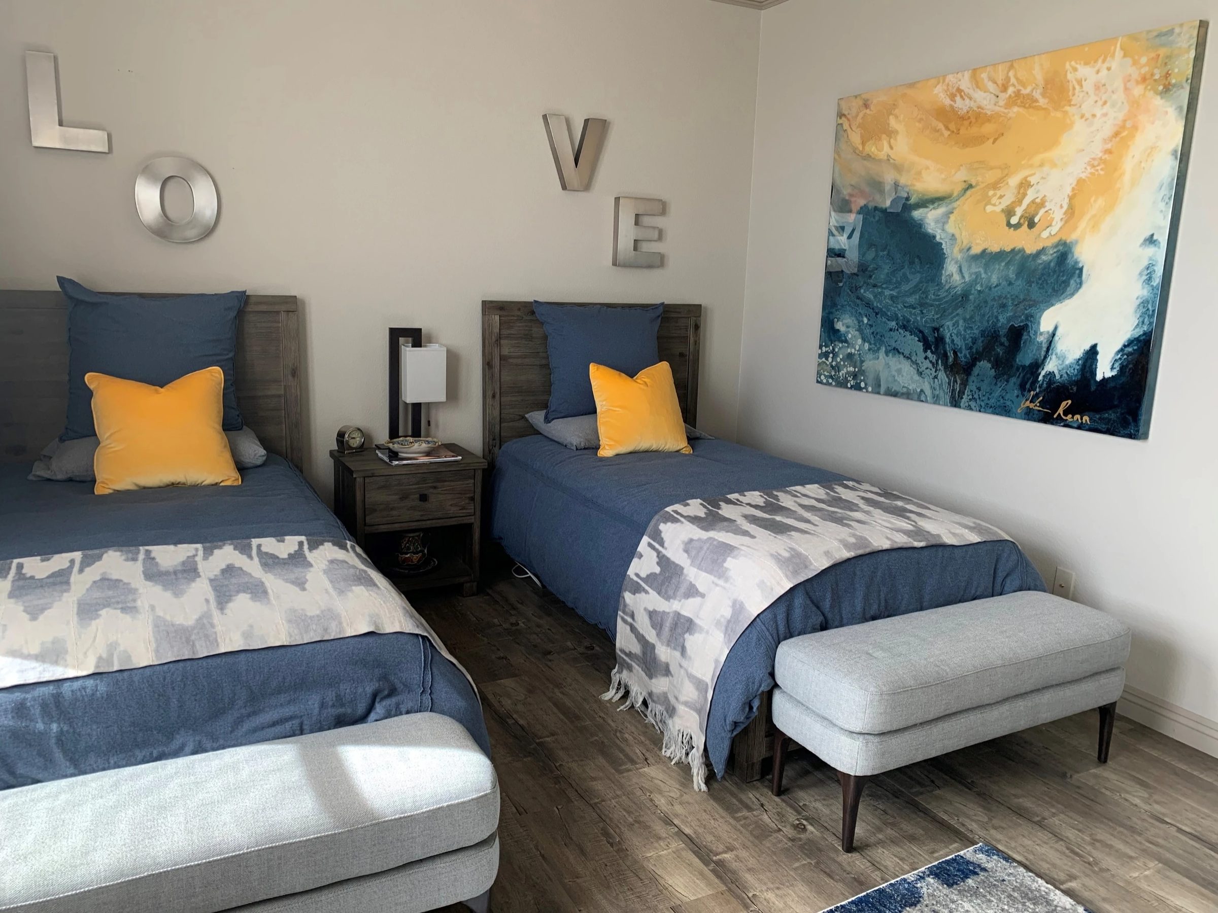 Kuda Huraa by Joline Renn — In a guest room, picking up the blue and gold of the bedding